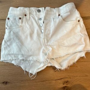 Levi’s 501 distressed white shorts